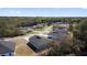 Expansive aerial view of a residential neighborhood nestled within a serene, tree-filled surrounding at 13594 Sw 40 Cir, Ocala, FL 34473