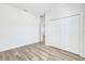 Clean bedroom with wood floors and a large closet at 13594 Sw 40 Cir, Ocala, FL 34473