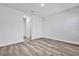 Spacious bedroom with neutral tones and wood flooring at 13594 Sw 40 Cir, Ocala, FL 34473