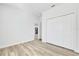 Bedroom showcasing wood-look flooring and spacious closet at 13594 Sw 40 Cir, Ocala, FL 34473