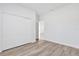 Simple bedroom design featuring wood floors and a large closet at 13594 Sw 40 Cir, Ocala, FL 34473
