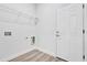 Laundry area with overhead shelving and washer-dryer hookups at 13594 Sw 40 Cir, Ocala, FL 34473