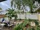 Back yard with garden, arbor and lush landscaping offering a serene outdoor retreat at 1361 Markham Woods Rd, Longwood, FL 32779