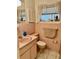 Retro pink bathroom features a tiled sink and walls with a decorative mirror at 1361 Markham Woods Rd, Longwood, FL 32779
