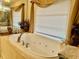 Luxurious bathroom with a large soaking tub, elegant fixtures, and a serene atmosphere at 1361 Markham Woods Rd, Longwood, FL 32779