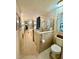 Bright bathroom featuring a walk-in shower with glass door and tile surround at 1361 Markham Woods Rd, Longwood, FL 32779