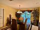 Cozy dining area with a chandelier, stylish decor, and easy access to the outdoor area at 1361 Markham Woods Rd, Longwood, FL 32779