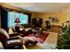 Spacious living room with ample seating, a TV, and natural light, perfect for relaxation and entertaining at 1361 Markham Woods Rd, Longwood, FL 32779