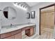 Bathroom features double sinks, a marble countertop, and walk-in shower at 14772 Eagles Crossing Dr, Orlando, FL 32837