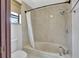 Bathroom features a tub-shower combo with a rainfall shower head fixture at 14772 Eagles Crossing Dr, Orlando, FL 32837