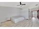 Bright bedroom features a ceiling fan, and wood-look flooring at 14772 Eagles Crossing Dr, Orlando, FL 32837