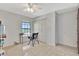 Neutral bedroom with a ceiling fan, a large closet, and natural light from a window overlooking a lake at 14772 Eagles Crossing Dr, Orlando, FL 32837