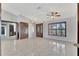 Entryway showcasing tile flooring, decorative doors, and a large window, offering an inviting first impression at 14772 Eagles Crossing Dr, Orlando, FL 32837