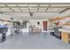 Spacious garage with epoxy floor and ample shelving at 14772 Eagles Crossing Dr, Orlando, FL 32837