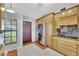 Bright kitchen featuring custom cabinets, granite countertops, and stainless appliances at 14772 Eagles Crossing Dr, Orlando, FL 32837