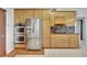 Modern kitchen featuring stainless appliances, custom cabinets, and double oven at 14772 Eagles Crossing Dr, Orlando, FL 32837