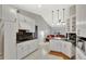 Bright kitchen with white cabinetry, granite countertops, and stainless steel appliances at 14772 Eagles Crossing Dr, Orlando, FL 32837