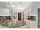Kitchen boasts granite countertops, stainless appliances, and updated white cabinets and lighting at 14772 Eagles Crossing Dr, Orlando, FL 32837