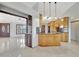 Open kitchen featuring stainless appliances, custom cabinets, and breakfast bar at 14772 Eagles Crossing Dr, Orlando, FL 32837