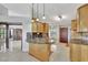 Bright kitchen featuring custom cabinets, granite countertops, and stainless appliances at 14772 Eagles Crossing Dr, Orlando, FL 32837