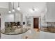 Kitchen boasts granite countertops, stainless appliances, and updated white cabinets and lighting at 14772 Eagles Crossing Dr, Orlando, FL 32837
