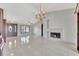 Open concept living room with tile flooring and fireplace at 14772 Eagles Crossing Dr, Orlando, FL 32837