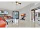 Bright living room with tile floors, patio access, and a view of the pool area at 14772 Eagles Crossing Dr, Orlando, FL 32837