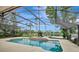 Enjoy the screened-in pool and serene lake views from the backyard at 14772 Eagles Crossing Dr, Orlando, FL 32837