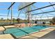 Screened-in pool with a serene lake view, creating a relaxing and private outdoor space at 14772 Eagles Crossing Dr, Orlando, FL 32837