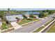 Neighborhood street view with single-story homes, well-maintained lawns, and mature trees at 14772 Eagles Crossing Dr, Orlando, FL 32837