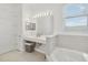 Modern bathroom showcasing a spacious sink and a bathtub, designed for relaxation and comfort at 1552 Fairview Cir, Reunion, FL 34747