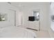 Bright bedroom with tile floors, a television, and ample closet space at 1552 Fairview Cir, Reunion, FL 34747