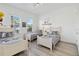 Spacious bedroom featuring three beds, themed decor and windows at 1552 Fairview Cir, Reunion, FL 34747