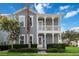 Charming two-story home featuring a double porch, well-maintained landscaping, and a welcoming facade at 1552 Fairview Cir, Reunion, FL 34747