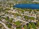 A beautiful aerial view shows the neighborhood and surrounding lake at 1716 2Nd Ne St, Winter Haven, FL 33881