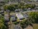 The aerial shows the home located in a neighborhood with nearby shops and parks at 1716 2Nd Ne St, Winter Haven, FL 33881