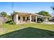 Charming single-story home with a covered carport and well-maintained front yard at 1716 2Nd Ne St, Winter Haven, FL 33881