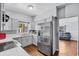 Modern updated kitchen with white cabinets and stainless steel appliances for a crisp look at 1716 2Nd Ne St, Winter Haven, FL 33881