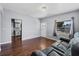 Living room filled with natural light, featuring hardwood floors and freshly painted walls at 1716 2Nd Ne St, Winter Haven, FL 33881