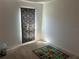 Bedroom features colorful accents and carpeted floors, great for a bedroom at 179 Blue Cypress Dr, Davenport, FL 33837