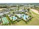 Aerial view of the community pool and recreation areas surrounded by manicured landscaping at 1830 Estuary Ln, Kissimmee, FL 34747