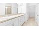Bathroom with double vanity, modern cabinets, and tiled floors at 1830 Estuary Ln, Kissimmee, FL 34747