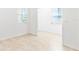 Bright room featuring tiled floors, white walls, and two windows that offers ample natural light at 1830 Estuary Ln, Kissimmee, FL 34747