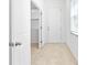 Bright entryway features neutral tile flooring and white trim, showcasing a clean and welcoming space at 1830 Estuary Ln, Kissimmee, FL 34747