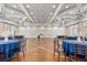 Elegant event space with high ceilings, chandeliers, and beautifully set tables for gatherings at 1830 Estuary Ln, Kissimmee, FL 34747