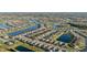 Aerial view of a community with homes, lakes, and lush landscaping at 188 Olympus Way, Kissimmee, FL 34759
