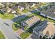 Aerial view of a neighborhood street with homes, driveways, and well-maintained lawns at 188 Olympus Way, Kissimmee, FL 34759