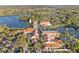 Aerial view of the community clubhouse with lake, pool, and landscaped grounds at 188 Olympus Way, Kissimmee, FL 34759