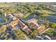 Aerial view of community clubhouse with pool, and landscaped grounds at 188 Olympus Way, Kissimmee, FL 34759