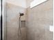 Close up of a shower with tile walls and a handheld shower head at 188 Olympus Way, Kissimmee, FL 34759